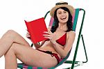 Attractive Bikini Woman Reading A Book Stock Photo