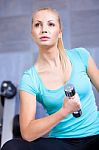 Attractive Blond 
 Sporty Girl Doing Biceps Training With Stock Photo