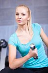 Attractive Blond  Sporty Girl Doing Biceps Training With Stock Photo
