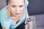 Attractive Blond Sporty Girl Doing Triceps Training With A Dumbb Stock Photo