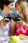 Attractive Couple Drinking Wine On Romantic Picnic In Countrysid Stock Photo