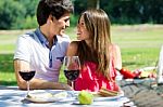 Attractive Couple On Romantic Picnic In Countryside Stock Photo