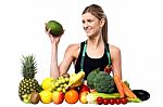 Attractive Girl With Heap Of Fruits And Vegetables Stock Photo
