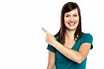 Attractive Lady Pointing Towards Copy Space Area Stock Photo