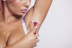 Attractive Pink Hair Woman Shaving Armpit With Pink Shaver Stock Photo