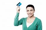 Attractive Woman Holding Up Cash Card Stock Photo