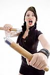 Attractive Young Female Holding Nunchaku Stock Photo