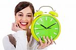 Attractive Young Model Smiling And Holding The Clock Stock Photo