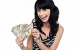 Attractive Young Woman Holding Money Stock Photo