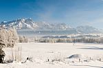 Austrian Winter Wonderland With Mountains, Fresh Snow And Haze Stock Photo