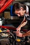 Auto Mechanic Fixing Car Engine Stock Photo