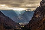 Autumn Valley In The Alps With Sunlight Breaking Through Stock Photo