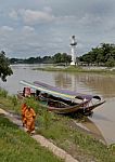 Ayuttaya Thailand- September 18 2016 : Priest Of Buddhist Walking Near River . They Take A Boat Trip Is A Routine Measure, Because They Are On An Island In The River Stock Photo