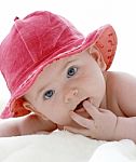 Baby In Red Hat Stock Photo