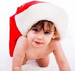 Baby In Santa Hat Crawling Stock Photo