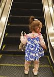 Baby Standing On Escalator Stock Photo