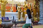 Back Pose Of Asian Woman Praying Thai Buddha Statue Stock Photo
