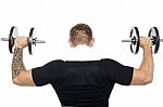 Back Pose Of Male Bodybuilder Lifting Weights Stock Photo
