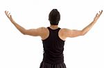 Back Pose Of Man With Raised Arms Stock Photo