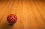 Basketball On Wooden Floor Stock Photo