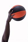 Basketball With Hands Of Man On A White Background Stock Photo
