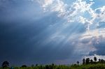 Beam Of Sunlight Behind Dark Clouds Stock Photo