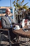 Bearded Businessman With Working Outside The Office Stock Photo