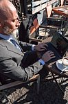 Bearded Businessman With Working Outside The Office Stock Photo