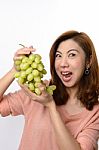Beautiful Asian Woman Shocked Expression While Holding Grape Stock Photo