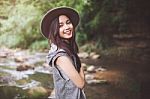 Beautiful Asian Woman Smiling Around The Nature Green And Water Stock Photo