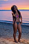 Beautiful Black African American Woman Posing On The Beach At Su Stock Photo