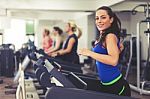 Beautiful Brunette On A Treadmill Stock Photo