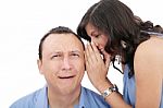 Beautiful Brunette Woman Whispering Into Her Boyfriends Ear Stock Photo