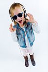 Beautiful Child Listening To Music With Digital Tablet Stock Photo