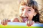 Beautiful Eight Year Old Girl Smiling On The Beach Stock Photo