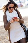 Beautiful Girl Chatting With Mobile Phone In Autumn Stock Photo