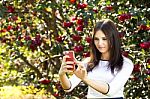 Beautiful Girl Posing For A Selfie With Her Smart Phone Stock Photo