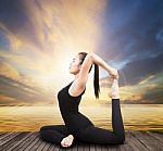 Beautiful Health Care Asian Woman Posting Yoga At Wood Terrace Sea Side Stock Photo
