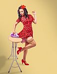 Beautiful Pinup Housewife Standing With Iron And Ironing Board Stock Photo