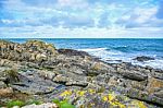 Beautiful Sea Wave Splashes Rocky Seashore At Peel Hill In Isle Of Man Stock Photo