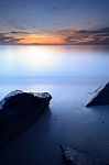 Beautiful Seascape Of Wave And Rock At The Sunrise Stock Photo