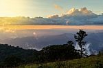 Beautiful Sun Rise On Top Mountain With Sun Ray Warm Tone Stock Photo