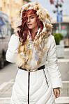 Beautiful Woman In Fur Coat On Street Stock Photo