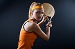 Beautiful Woman Playing Padel Indoor. Isolated On Black Stock Photo