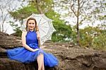 Beautiful Woman Wear Blue Evening Dress Hold White Umbrella Watc Stock Photo
