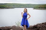 Beautiful Woman Wear Blue Evening Dress Over Mountains And River Stock Photo