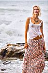 Beautiful Young Blonde Woman Posing Outdoor At The Rocky Sea Sho Stock Photo