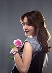 Beautiful Young Girl With A Pink Rose Stock Photo