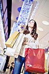Beautiful Young Woman Holding Shopping Bags Stock Photo