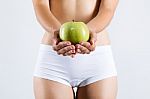 Beautiful Young Woman In White Underwear Holding Green Apple Stock Photo